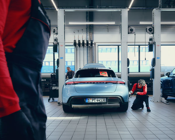 Porsche Technician performing service