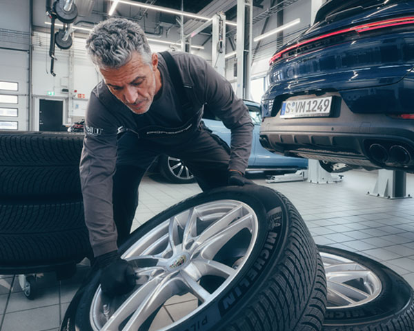 Porsche Technician with tires