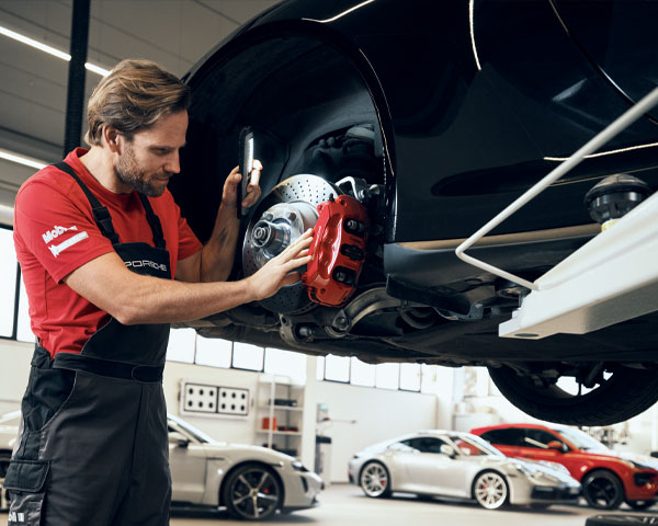 Porsche Technician performing brake service